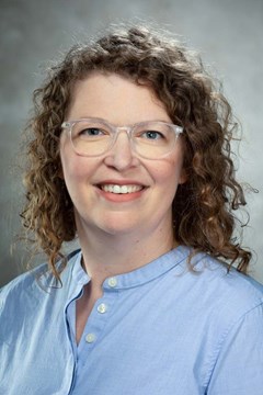 Professor photographed at her desk