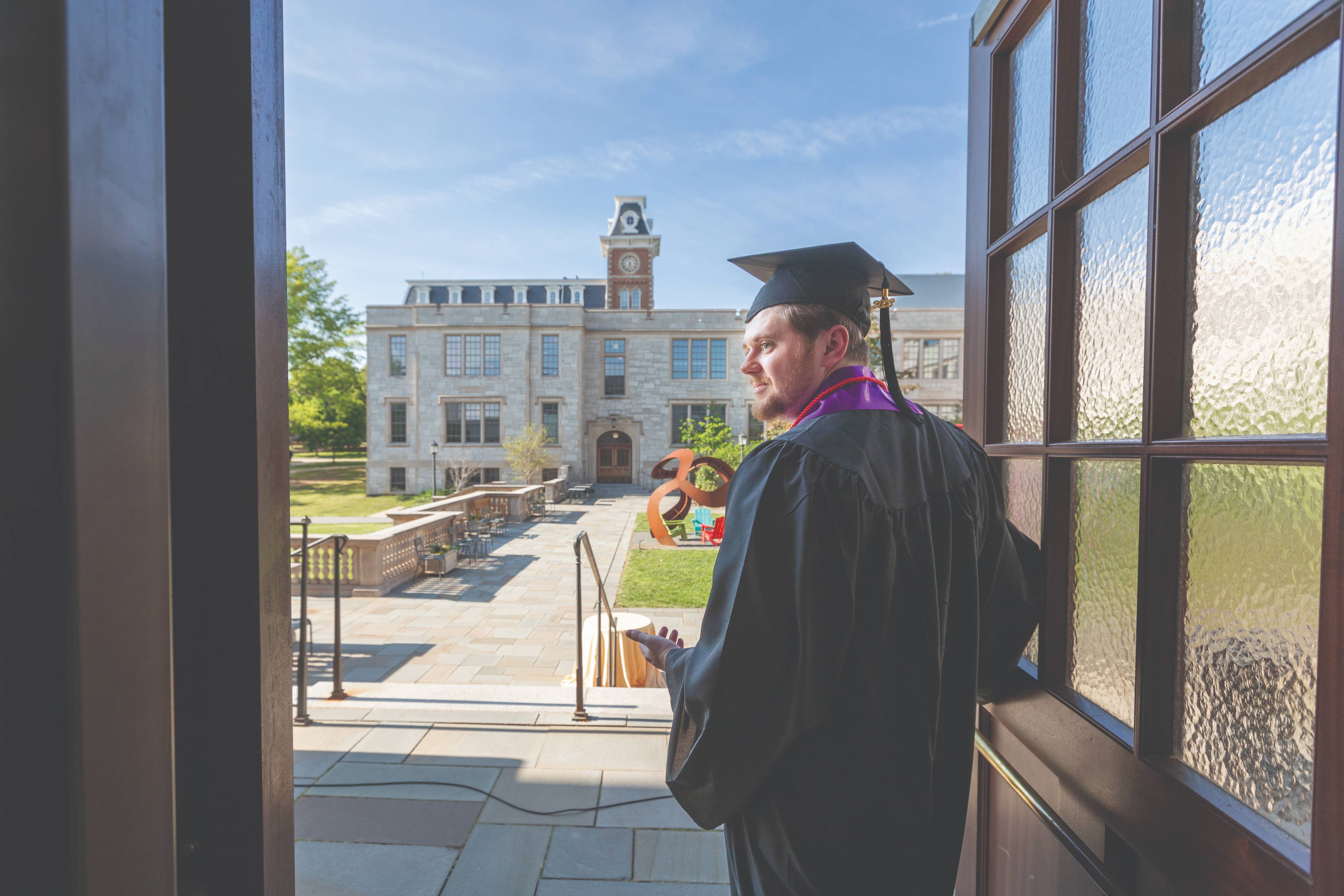 Student at the door of Gearhart Hall