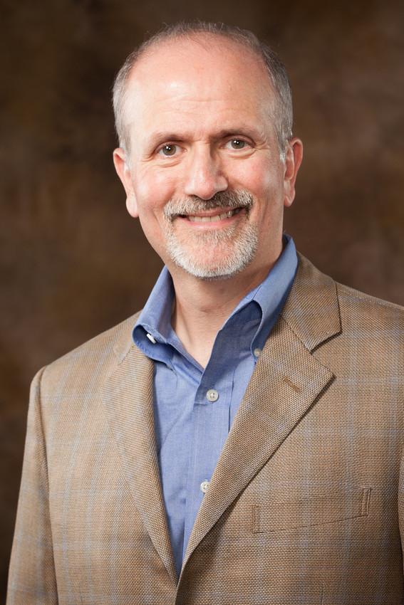 portrait of man in blue shirt