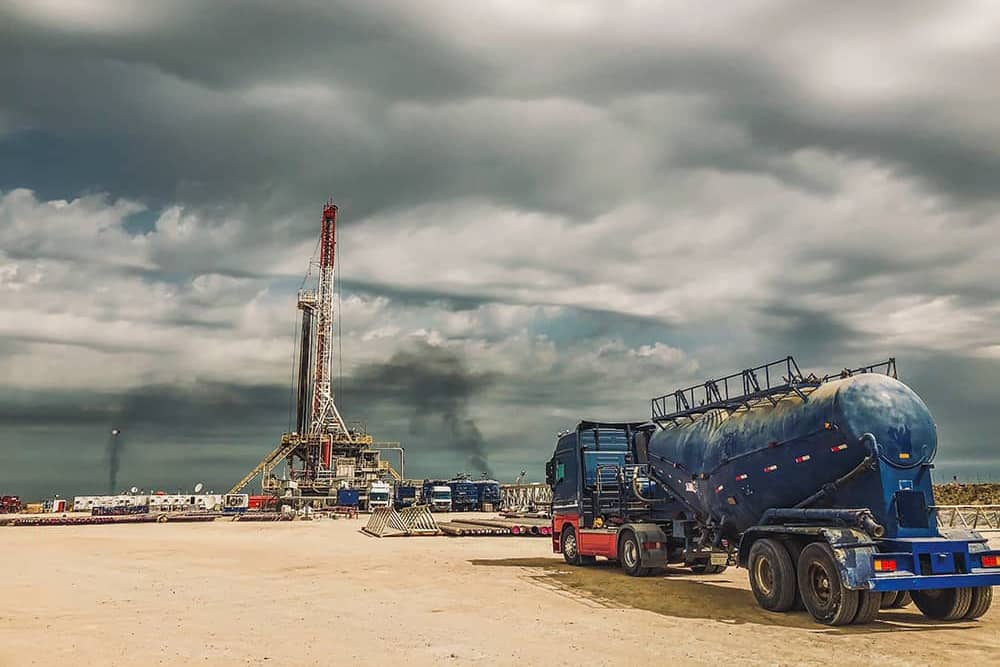 a tanker truck and gas or oil well