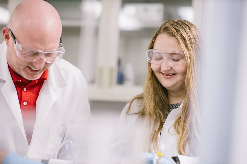 Professor and student work together in lab