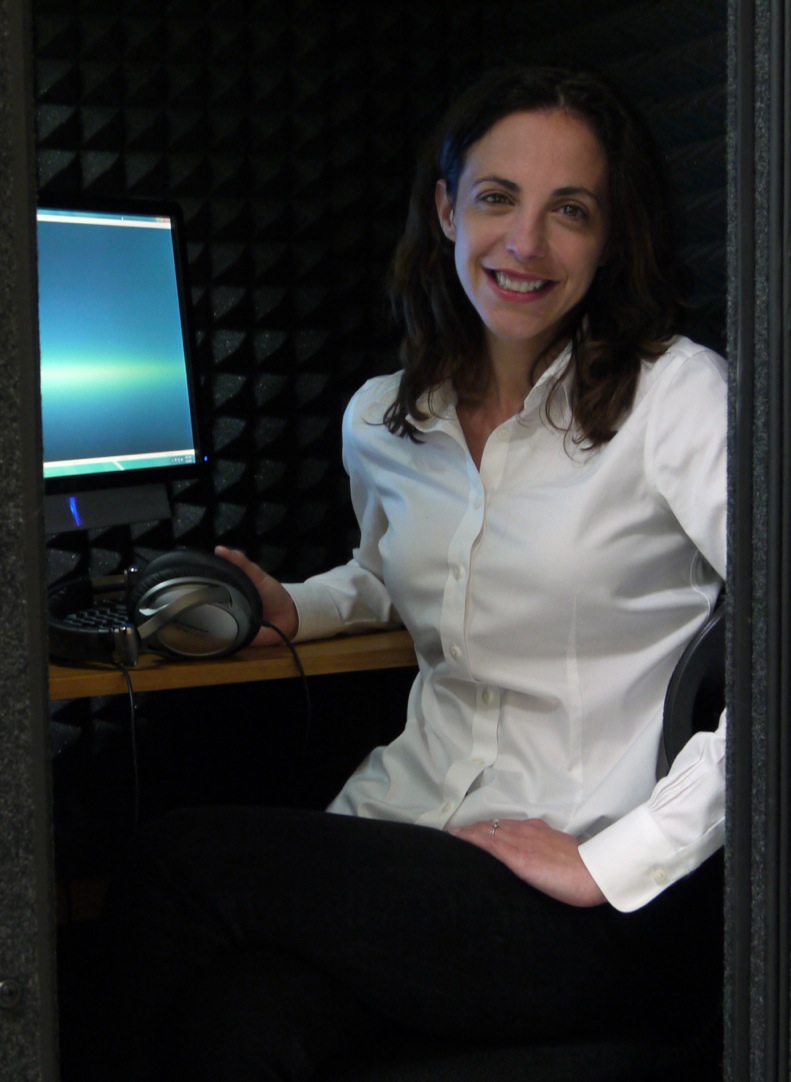 woman sits at computer