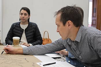 Landscape architecture professor draws/brainstorms in studio.