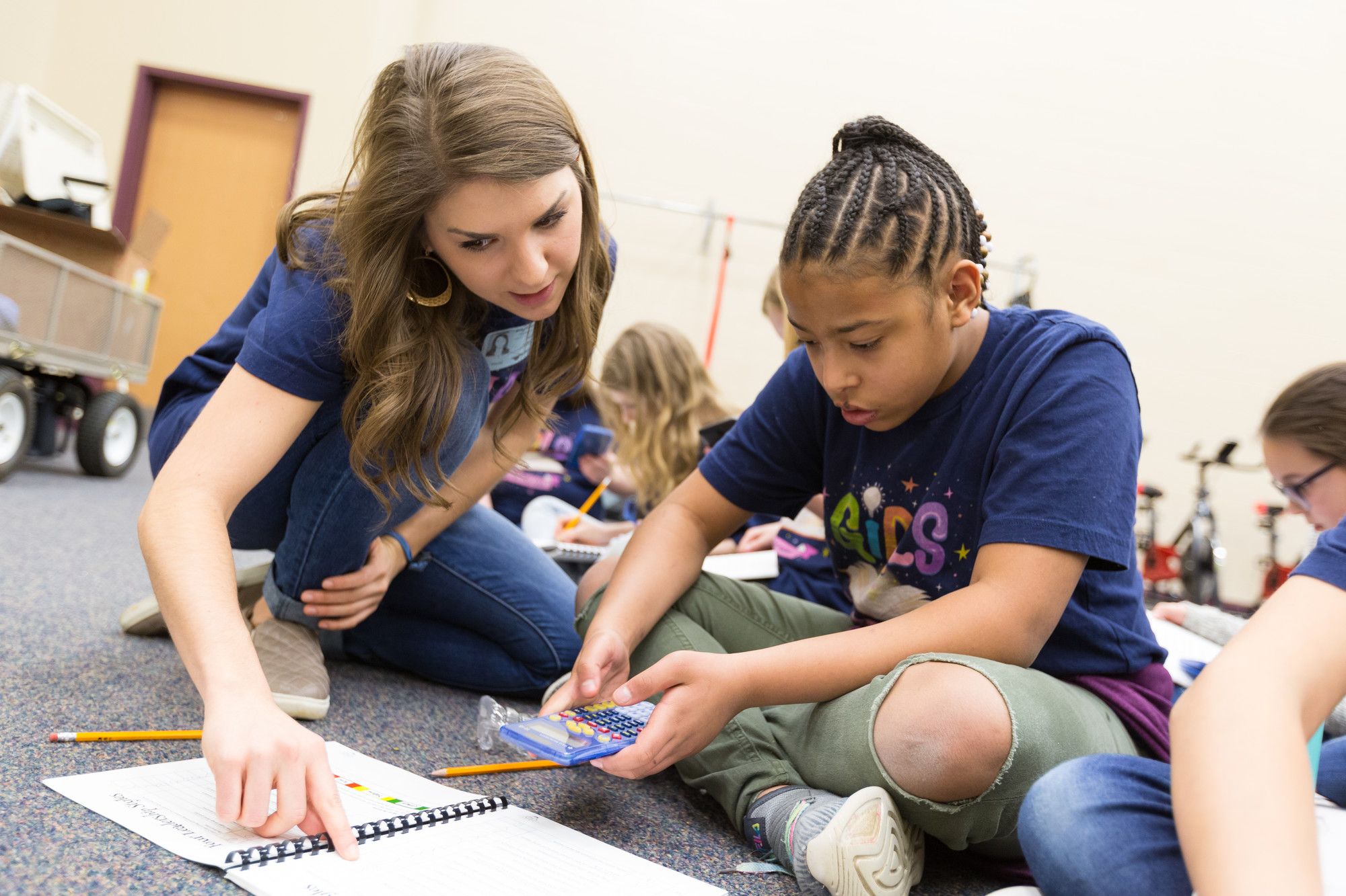 college student helps middle school student with math