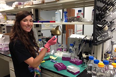 Woman works in lab.