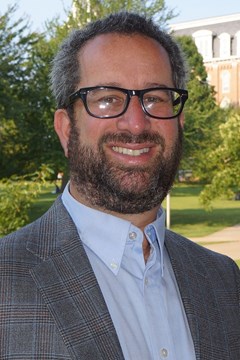 portrait of man in front of trees