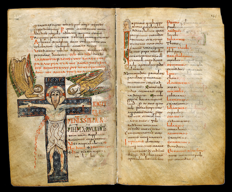 Medieval manuscript open to picture of Jesus on the cross