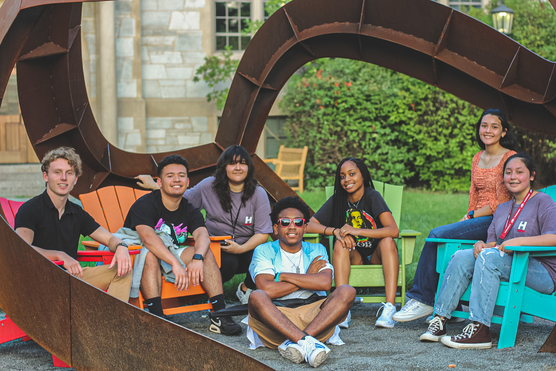 Path students sit outside the Curvahedra sculpture. 